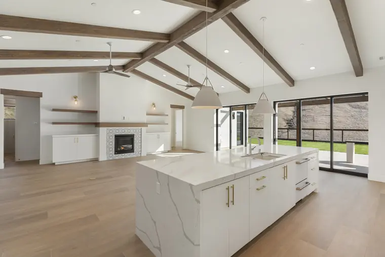 Kitchen island looking across the great room to the fireplace
