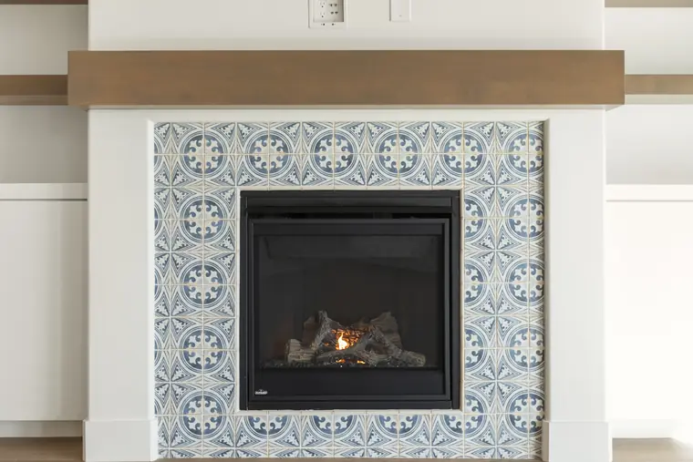 Fireplace with a blue-and-white tile surround