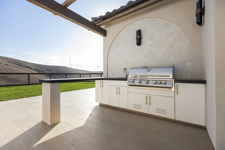 Outdoor kitchen with a built-in grill