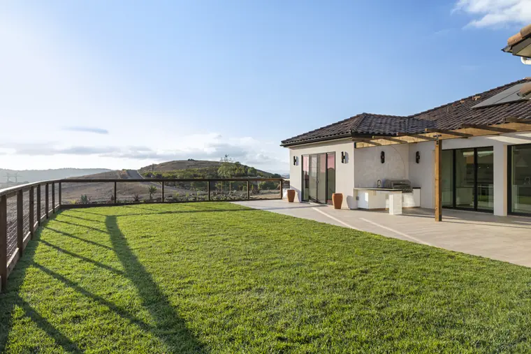 Back lawn and patio looking out over the hills