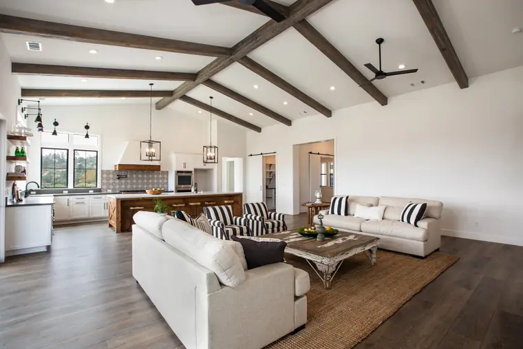 Great room with exposed beams, open to the kitchen