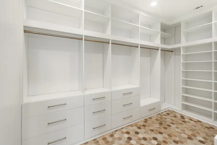 Walk-in closet with built-in drawers and shelving
