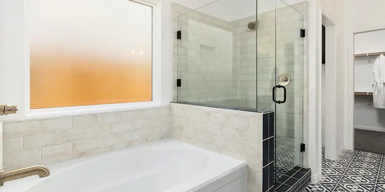 Primary bath with a soaking tub and glass shower