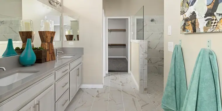 Primary bath with a double vanity and walk-in shower
