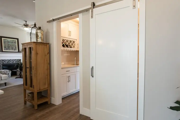 Barn door and hutch in a bedroom hallway