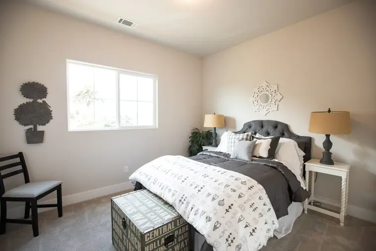 Bedroom with an upholstered headboard and natural light