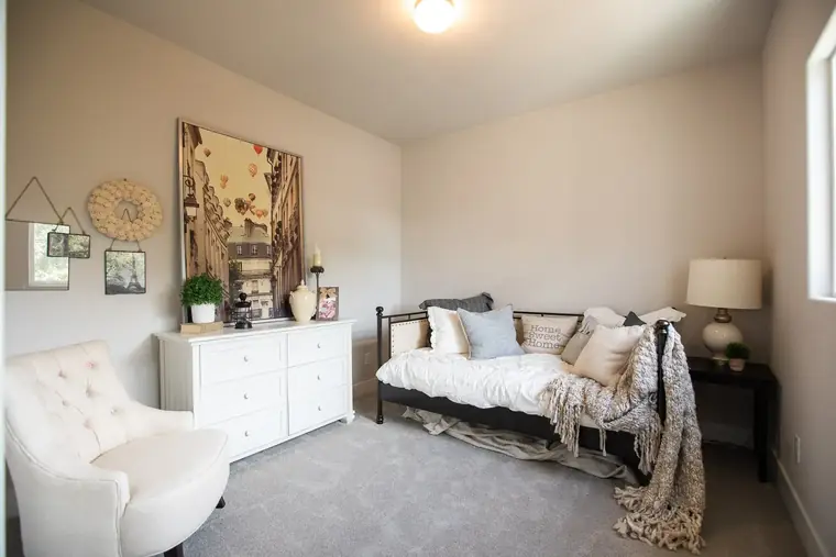 Guest bedroom with a daybed and dresser