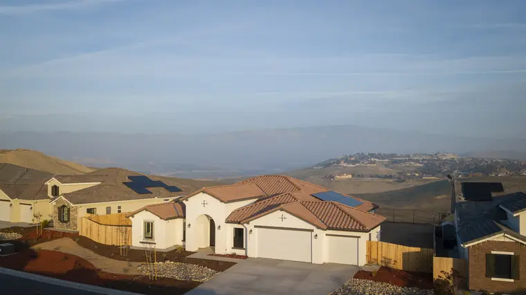 Aerial view of homes at Vista Montaire with hills beyond