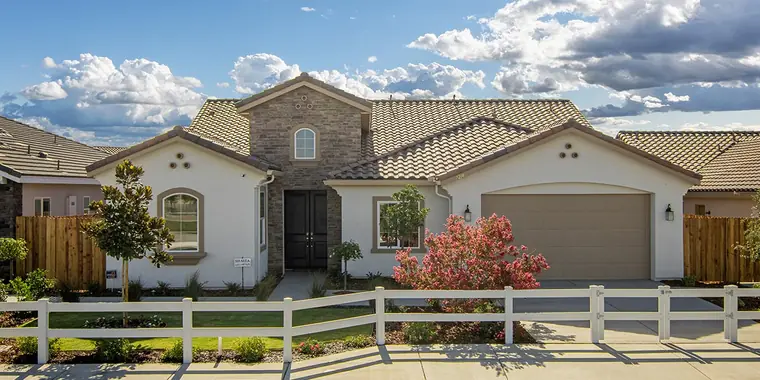 Single-story home with stone accents and a tile roof