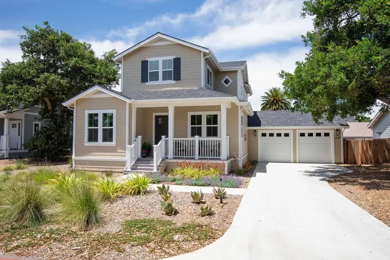 Two-story home with a covered front porch and two-car garage