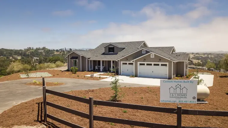 Single-story home with a stone accent and landscaped yard