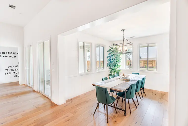 Dining room with a chandelier and tall windows
