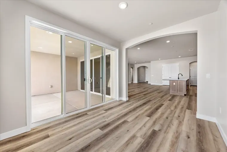 Dining area with a wide sliding glass door to the covered patio