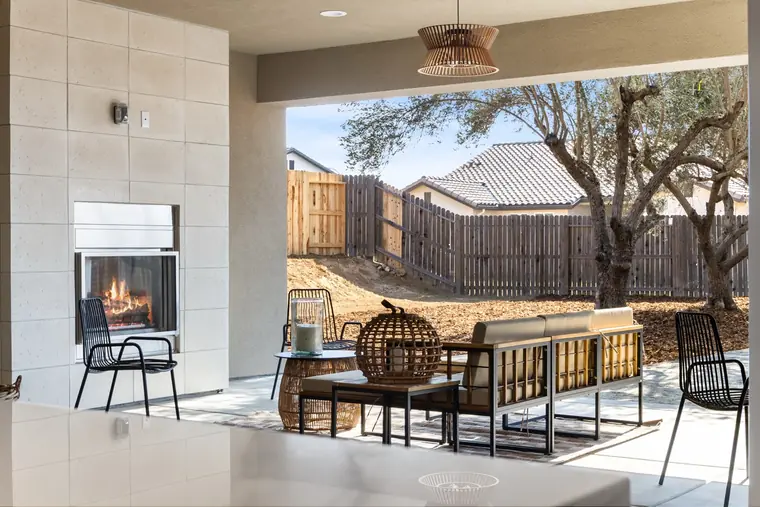 Pocket sliding doors opening the great room to the covered patio