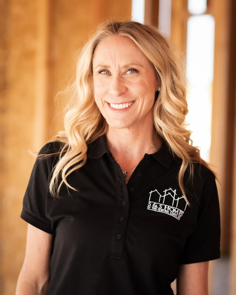 Erin Foster, S&S Homes customer care representative, smiling in a black S&S Homes polo